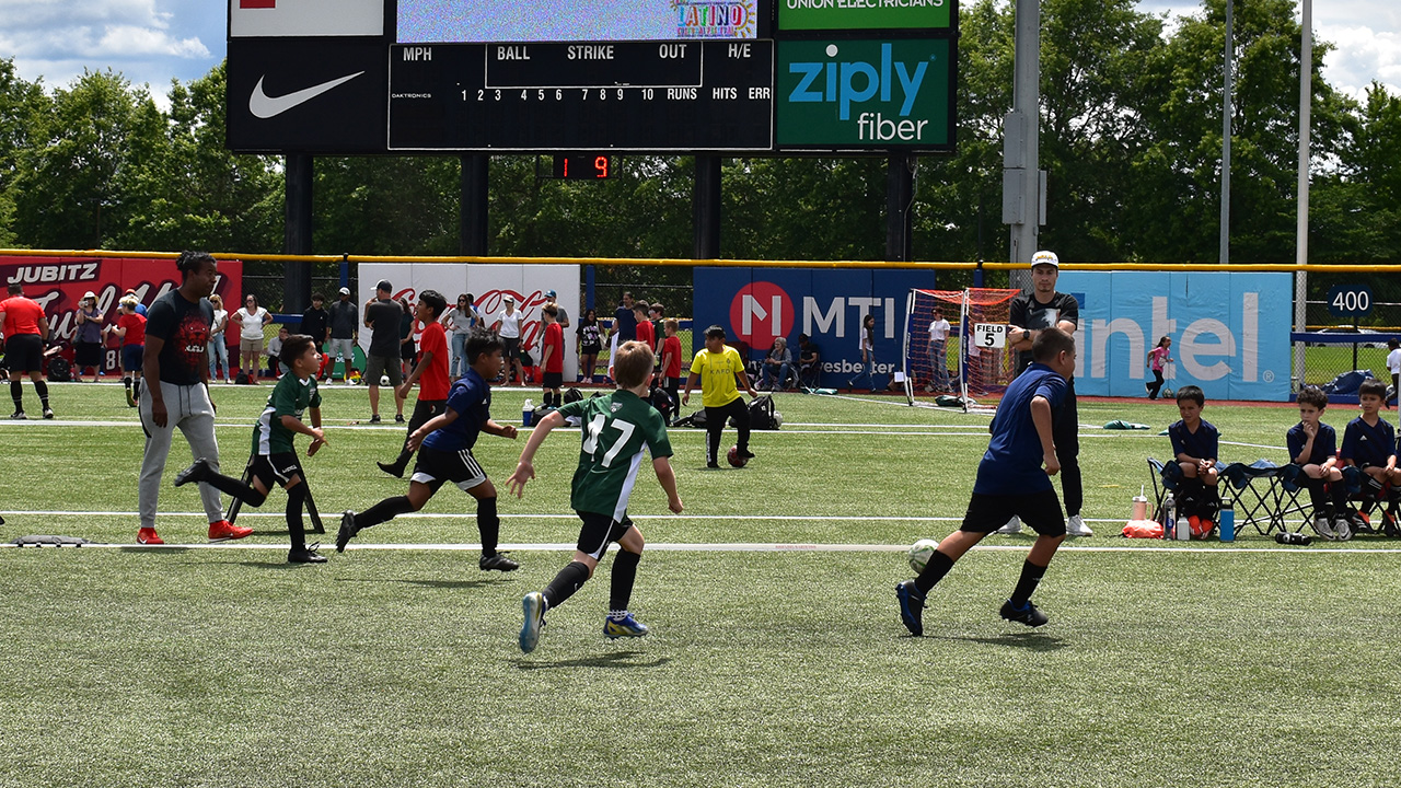 Kids playing sports on the field