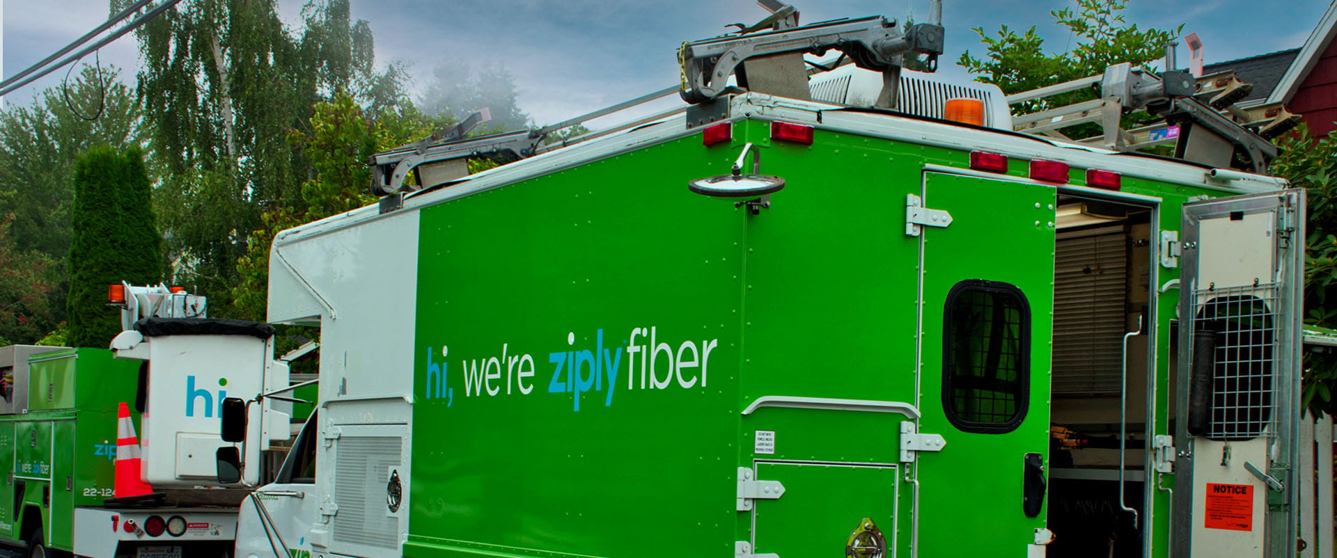 Two Ziply Fiber construction vehicles in a newly expanded neighborhood.