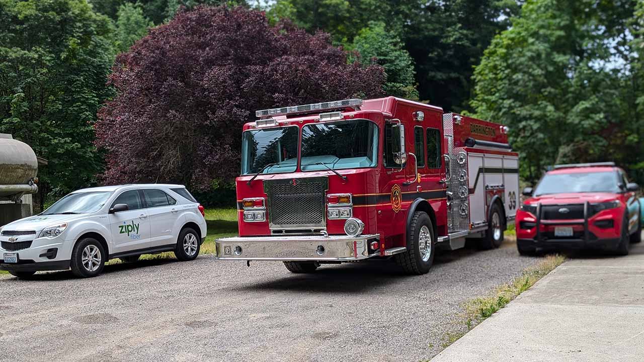 Snohomish County Firetruck parked next to a Ziply Fiber vehicle