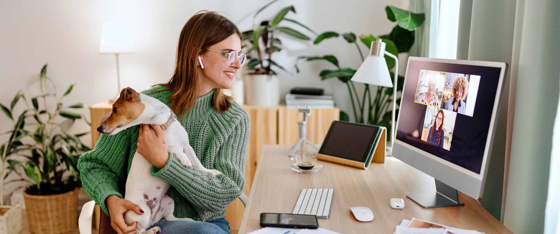 Remote worker shows off a furry companion during a client video call, seamlessly connected over fiber-optic WiFi