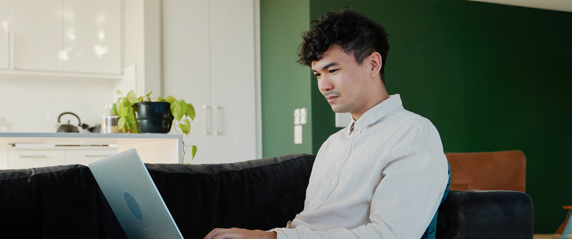 Consulting professional connects a new laptop to fast fiber-optic WiFi internet. 