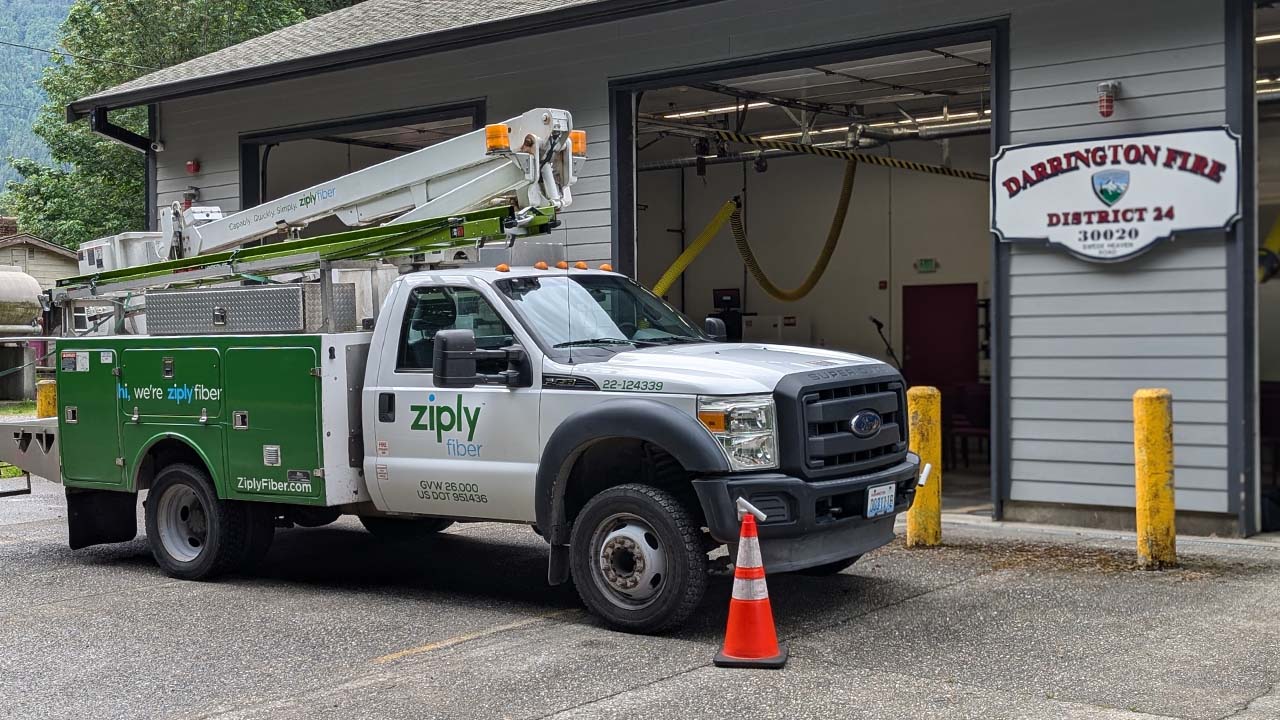 Ziply Fiber construction truck parked outside of the District 24 Darrington fire station