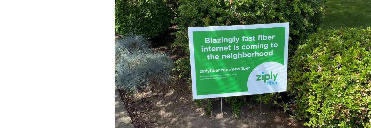 Neighborhood construction sign that reads: Blazingly fast fiber internet is coming to the neighborhood. 