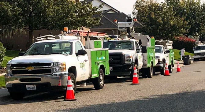 Ziply Fiber construction trucks on neighborhood street
