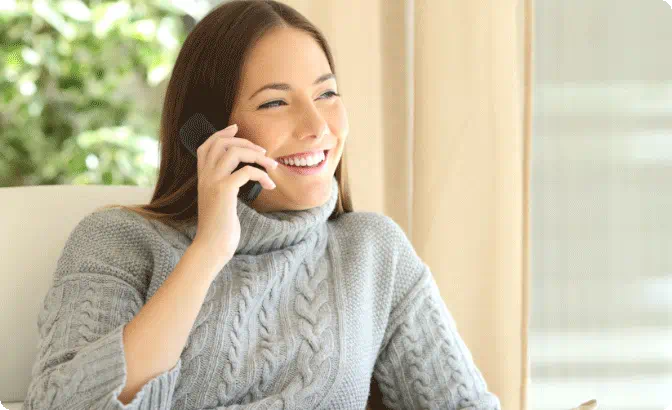 Woman smiling on a business call 