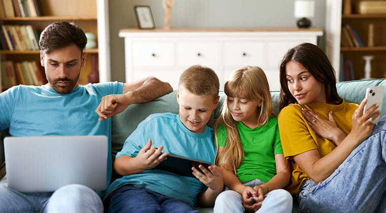 Family on couch using Ziply Fiber internet