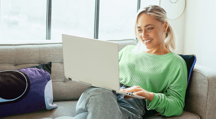 New apartment resident smiling after activating fast fiber internet in just a couple of easy steps