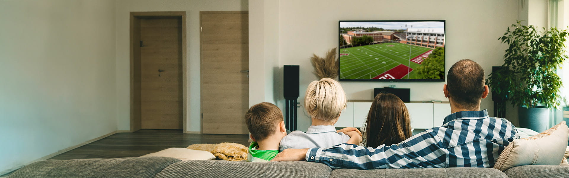 Family streams a Mariners game over fast fiber-optic internet. 